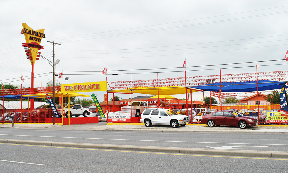 Picture of vehicles for sale outside the offices at M & S Auto Sales.